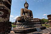 Thailand, Old Sukhothai - Wat Mahathat, statue of seated Buddha of the bot. 